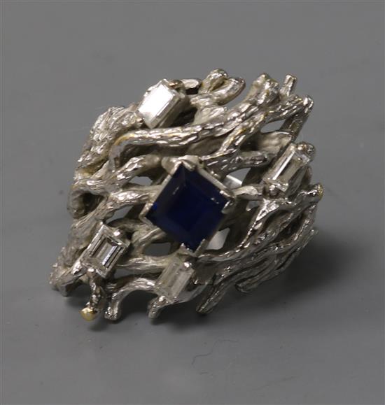 An 18ct white gold, diamond and gem set rustic form dress ring, size O.